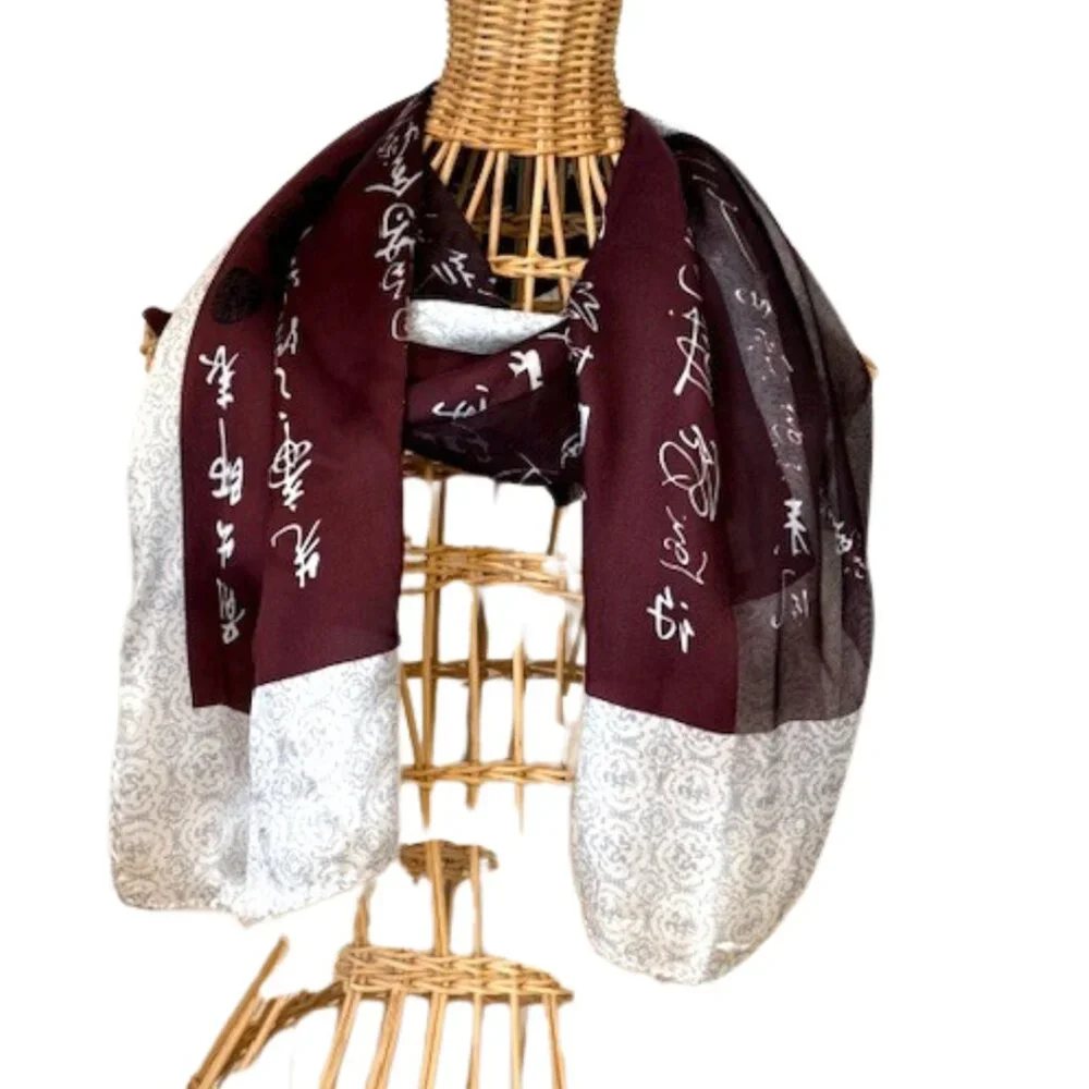 100% silk wine colored and silver oblong scarf.